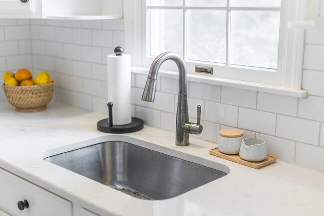 20 Mutiny Way Mashpee, MA 02649 - Photo 16 of 36 a kitchen with a sink and a potted plant