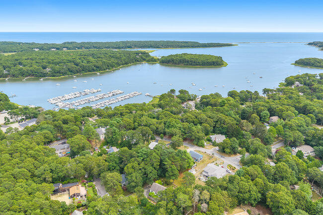 20 Mutiny Way Mashpee, MA 02649 - Photo 2 of 36 a view of a lake with a yard