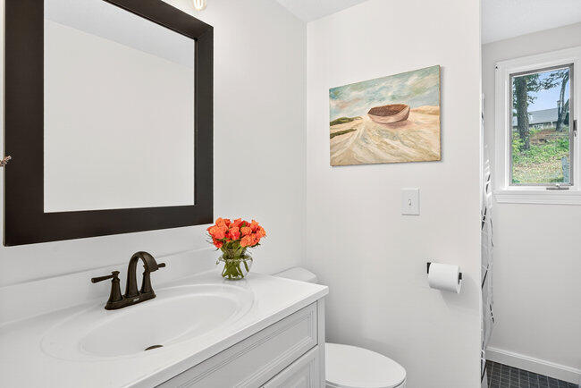 20 Mutiny Way Mashpee, MA 02649 - Photo 23 of 36 a bathroom with a toilet sink and mirror