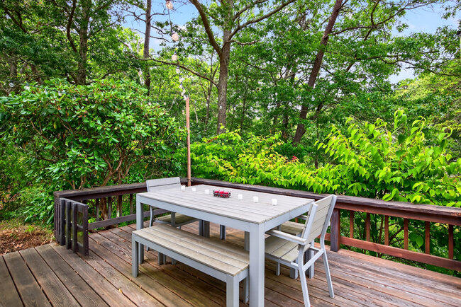 20 Mutiny Way Mashpee, MA 02649 - Photo 26 of 36 a view of a dinning table and chairs in the roof deck