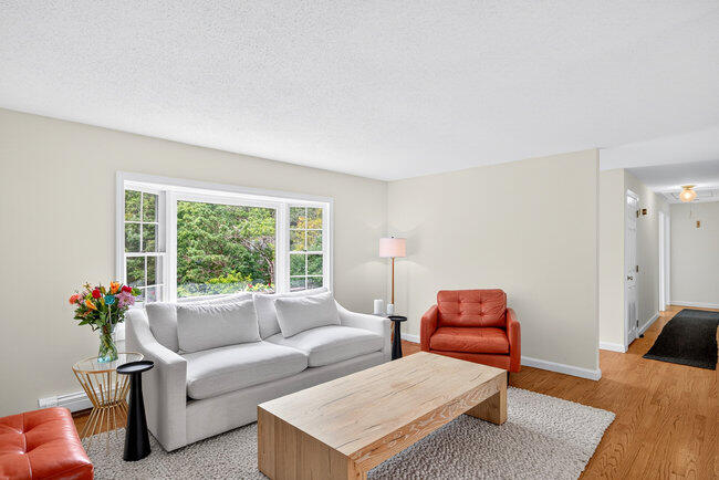 20 Mutiny Way Mashpee, MA 02649 - Photo 9 of 36 a living room with furniture and a potted plant