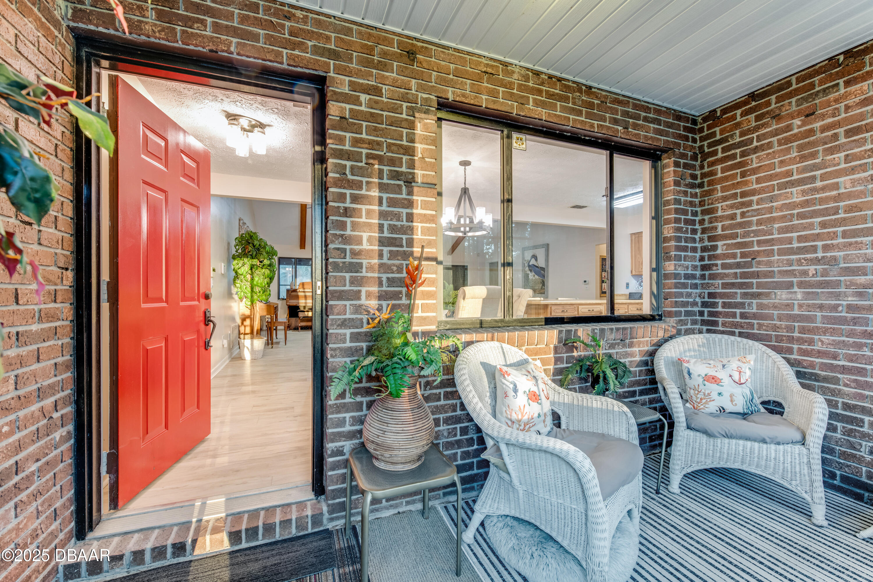 46 Winchester Road Ormond Beach, FL 32174 - Photo 12 of 92 a view of a patio with couple of chairs and a potted plant