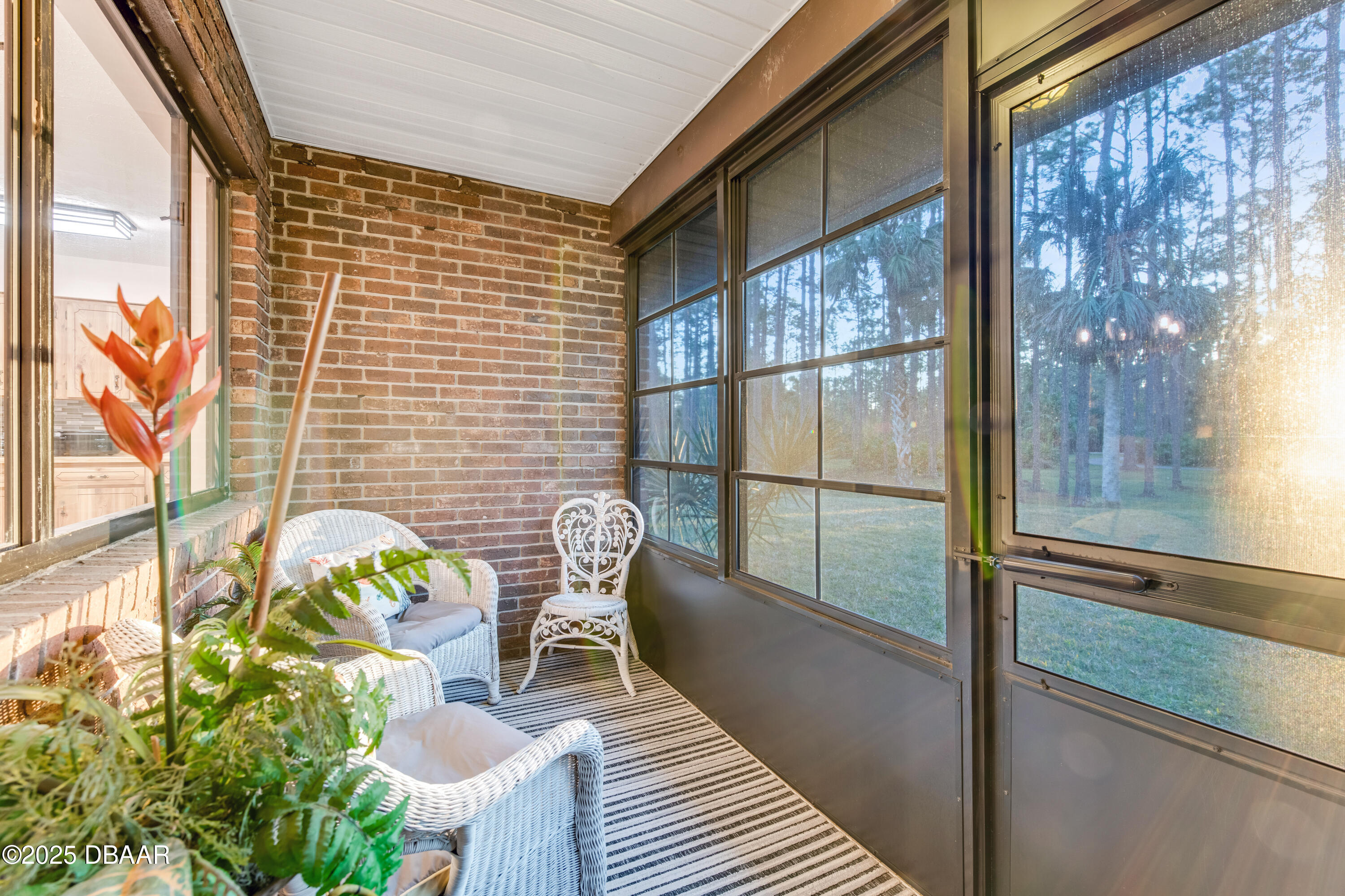 46 Winchester Road Ormond Beach, FL 32174 - Photo 13 of 92 a view of a balcony with chairs and a potted plant