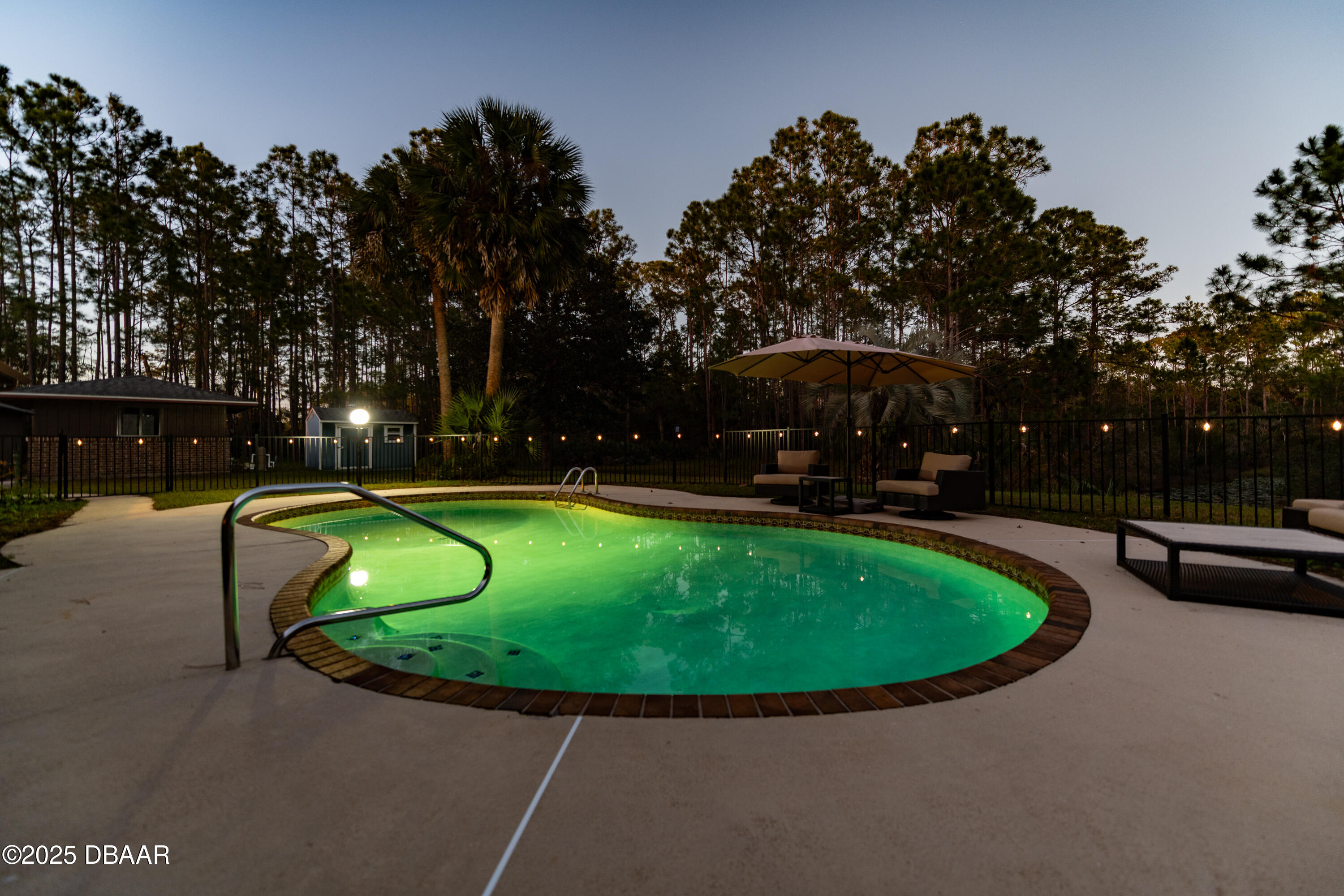 46 Winchester Road Ormond Beach, FL 32174 - Photo 18 of 92 Lit Up Pool Evening!