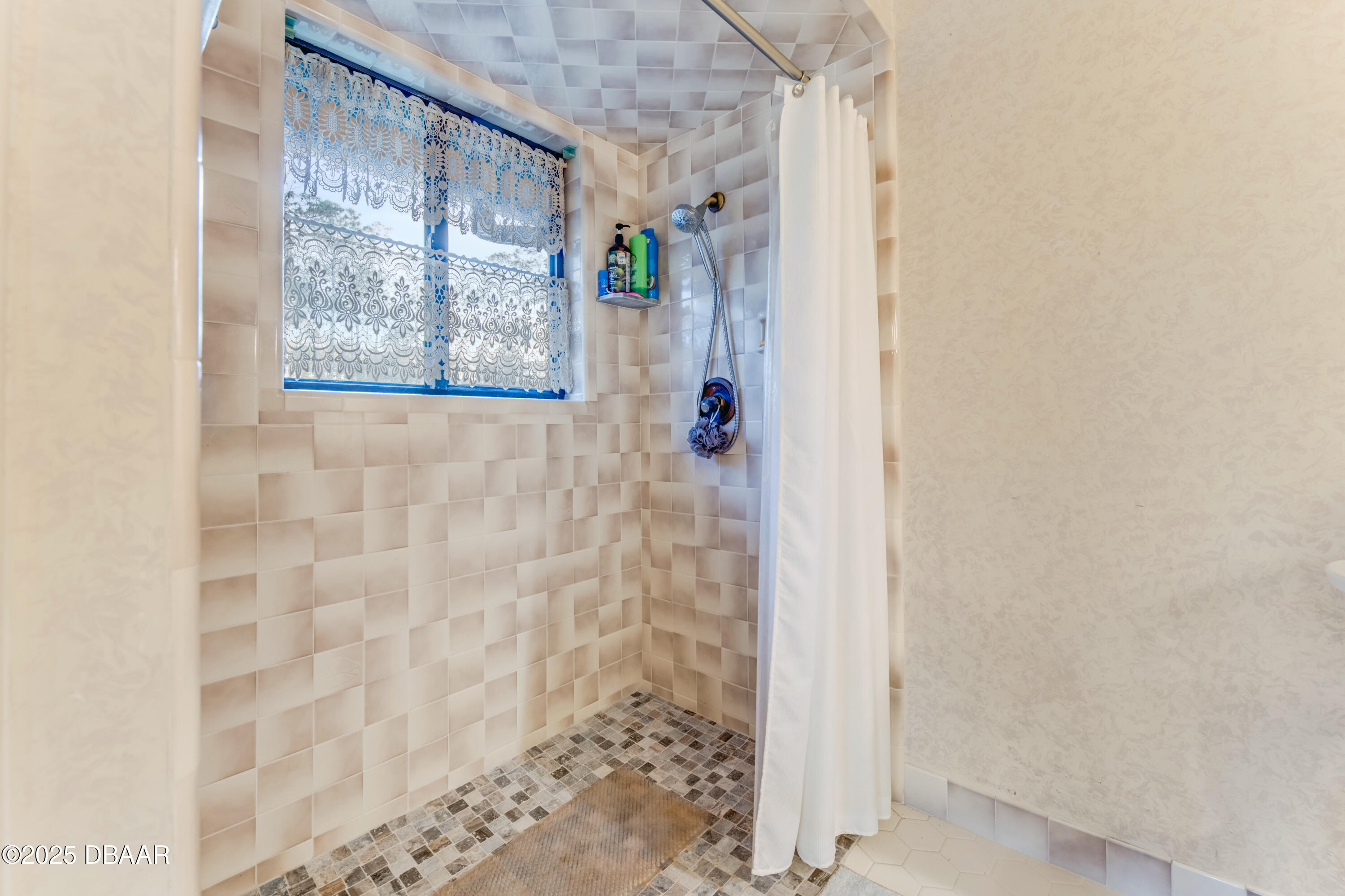 46 Winchester Road Ormond Beach, FL 32174 - Photo 34 of 92 a bathroom with a shower and a window