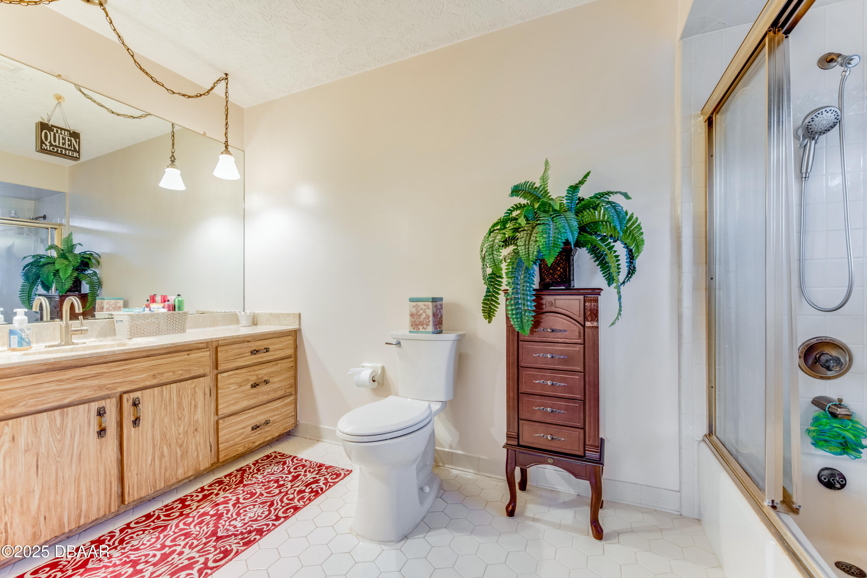 46 Winchester Road Ormond Beach, FL 32174 - Photo 42 of 92 a bathroom with a granite countertop sink a toilet and a mirror