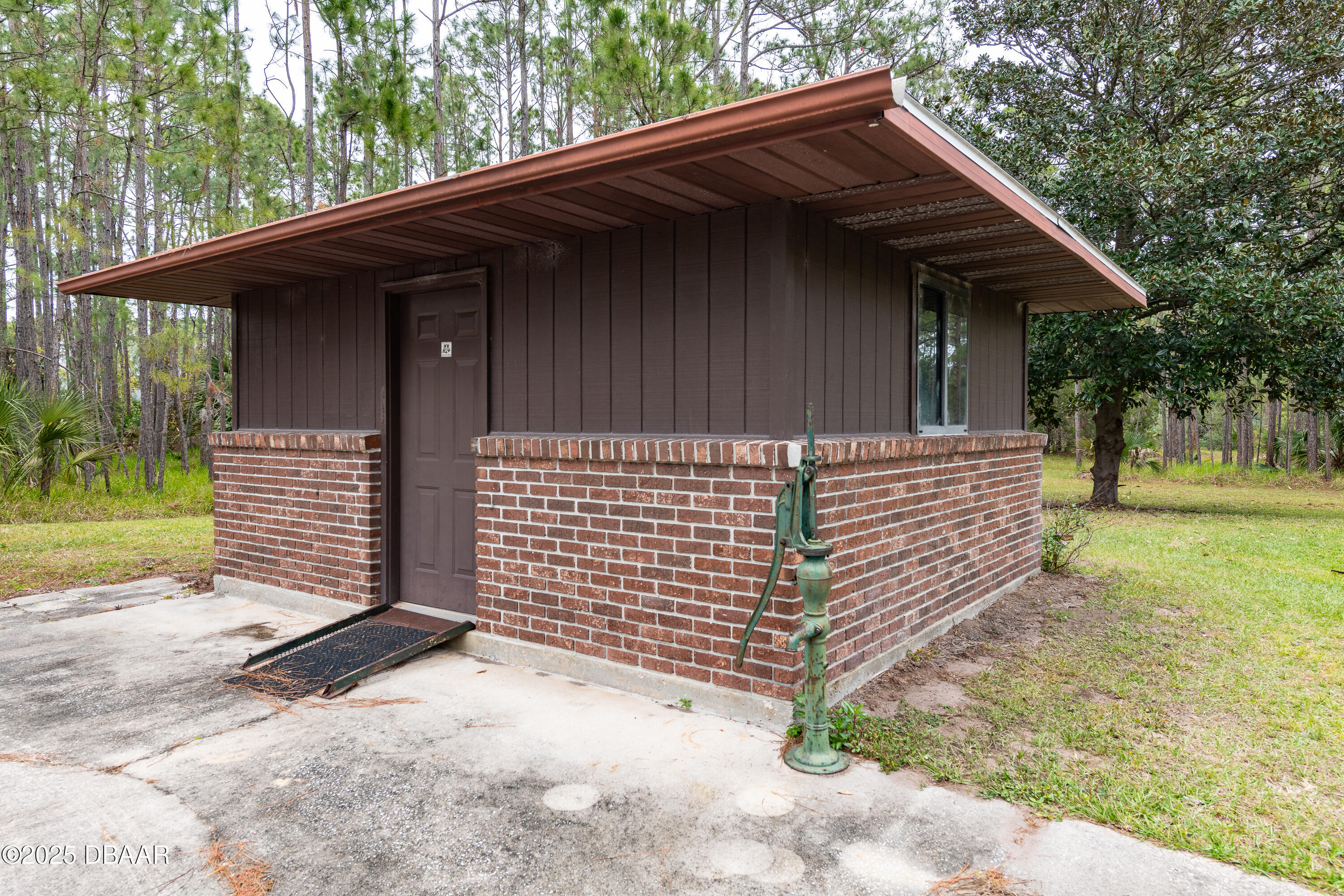46 Winchester Road Ormond Beach, FL 32174 - Photo 47 of 92 a view of a house with a yard