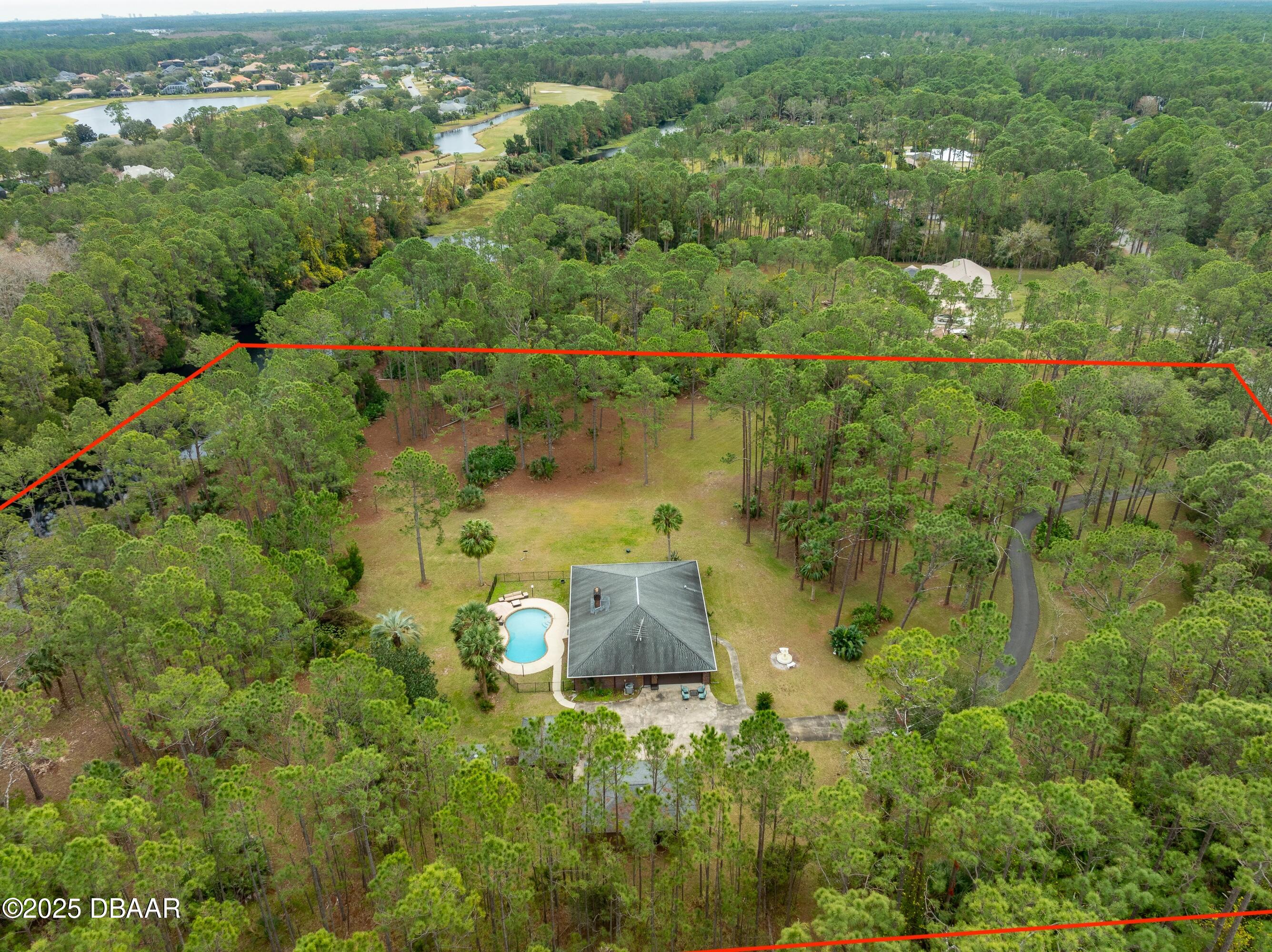 46 Winchester Road Ormond Beach, FL 32174 - Photo 55 of 92 an aerial view of residential houses with outdoor space and trees