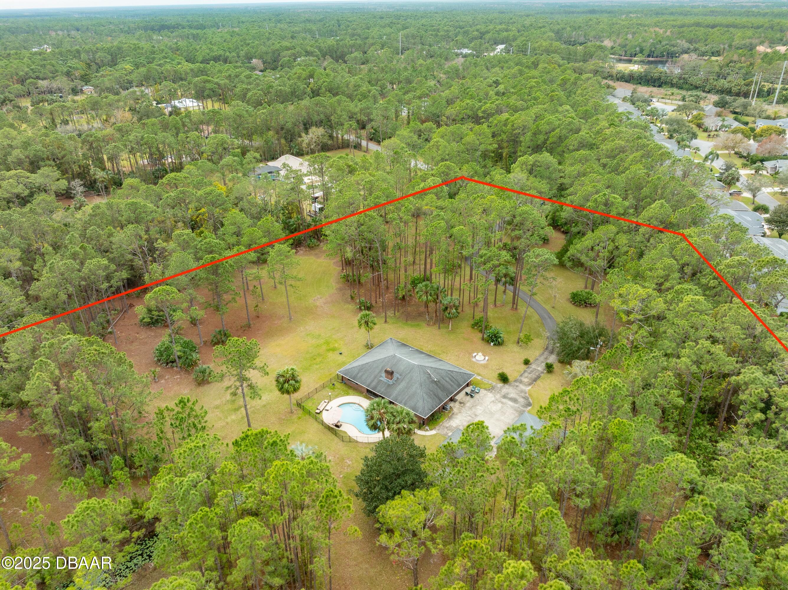 46 Winchester Road Ormond Beach, FL 32174 - Photo 56 of 92 an aerial view of residential houses with outdoor space and trees