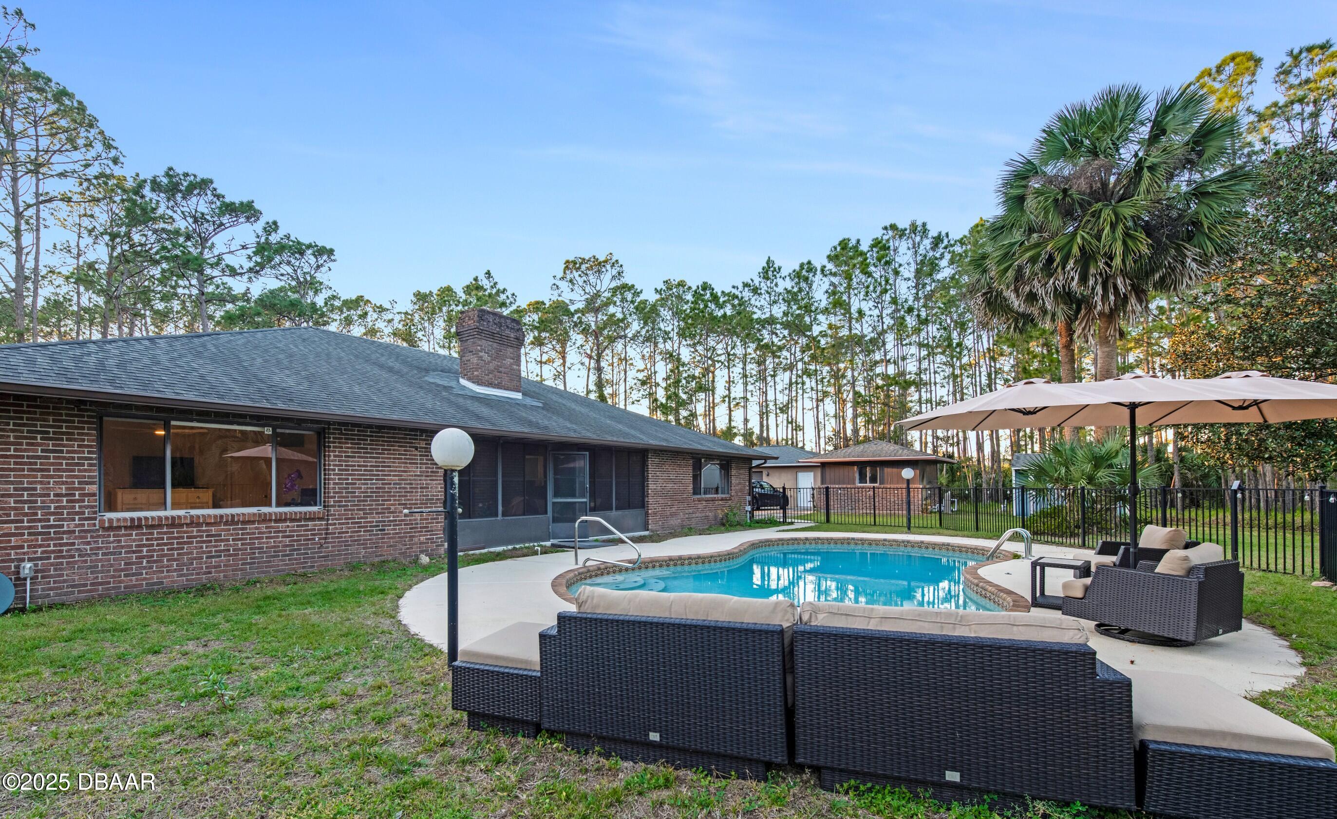 46 Winchester Road Ormond Beach, FL 32174 - Photo 6 of 92 a view of a house with a yard and furniture