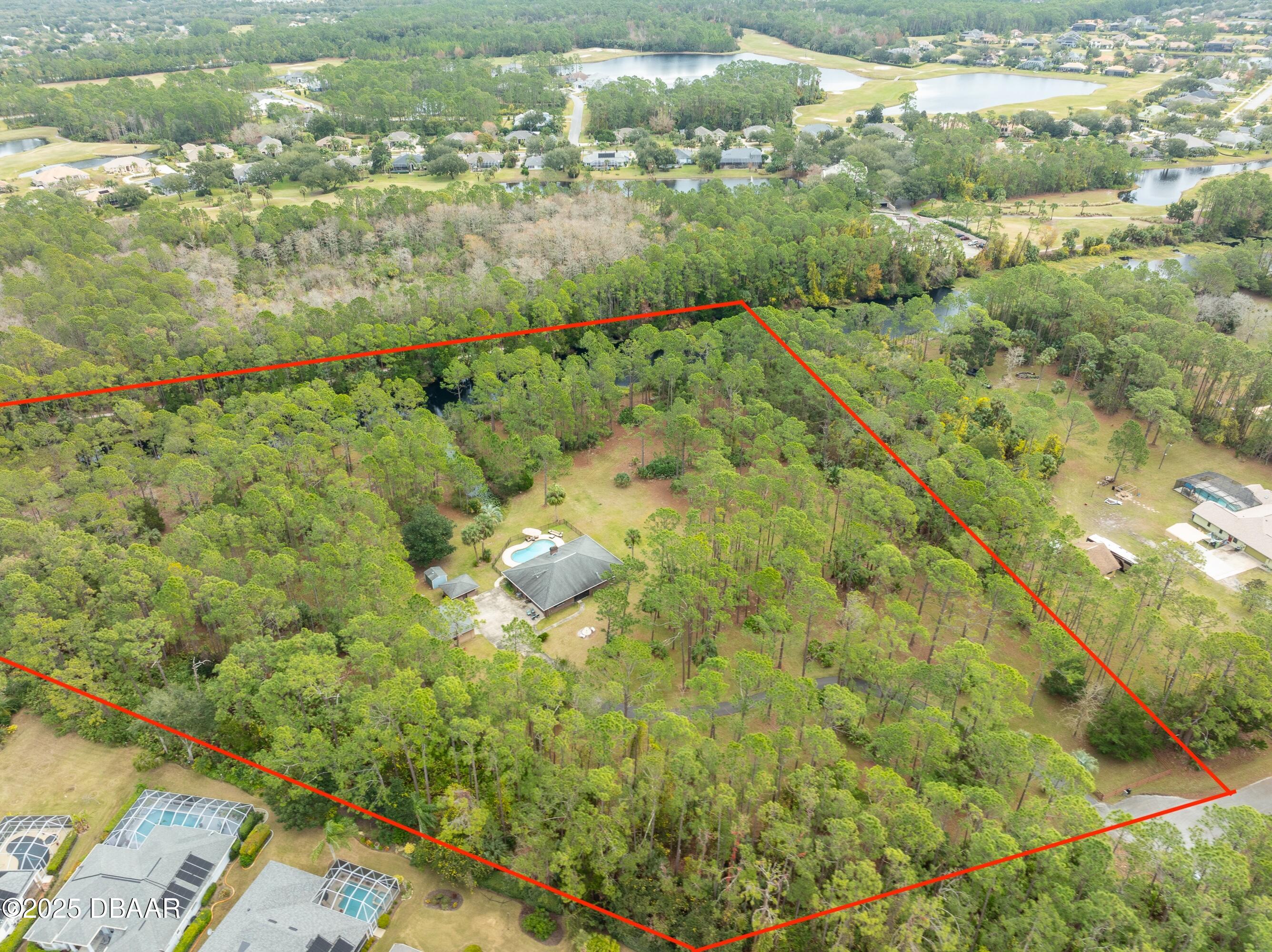 46 Winchester Road Ormond Beach, FL 32174 - Photo 65 of 92 a view of a lake with a city