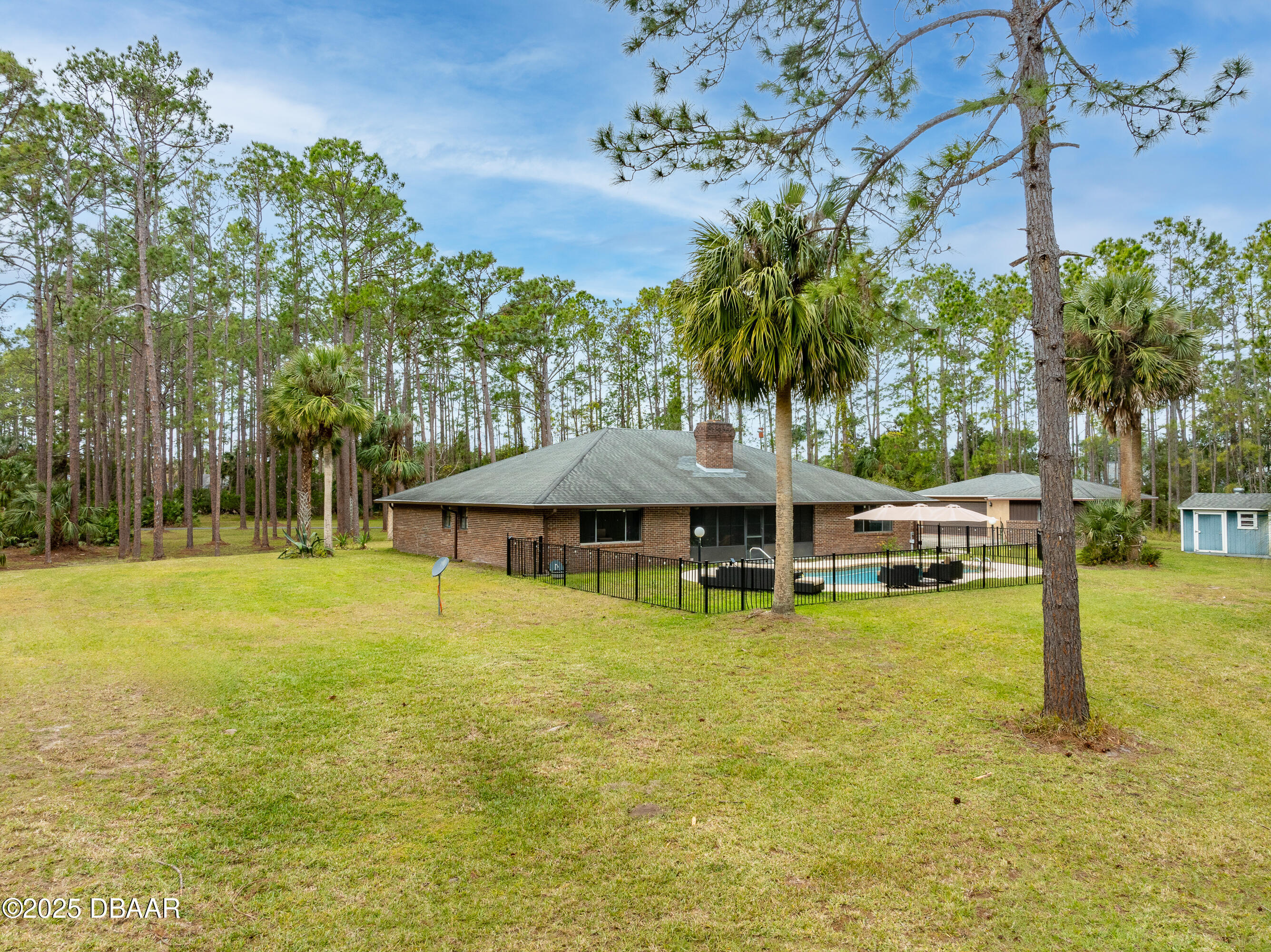 46 Winchester Road Ormond Beach, FL 32174 - Photo 73 of 92 a view of a swimming pool with lounge chair