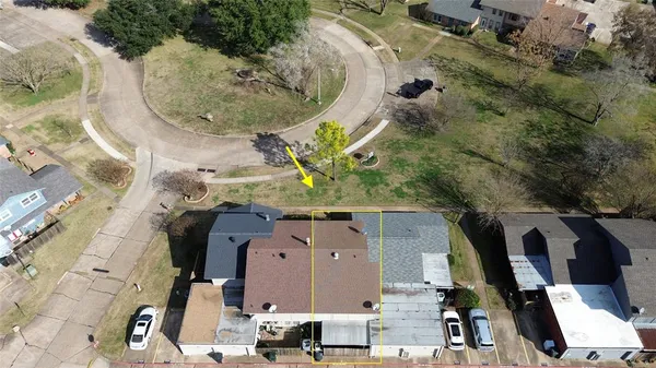 an aerial view of a highlighted house
