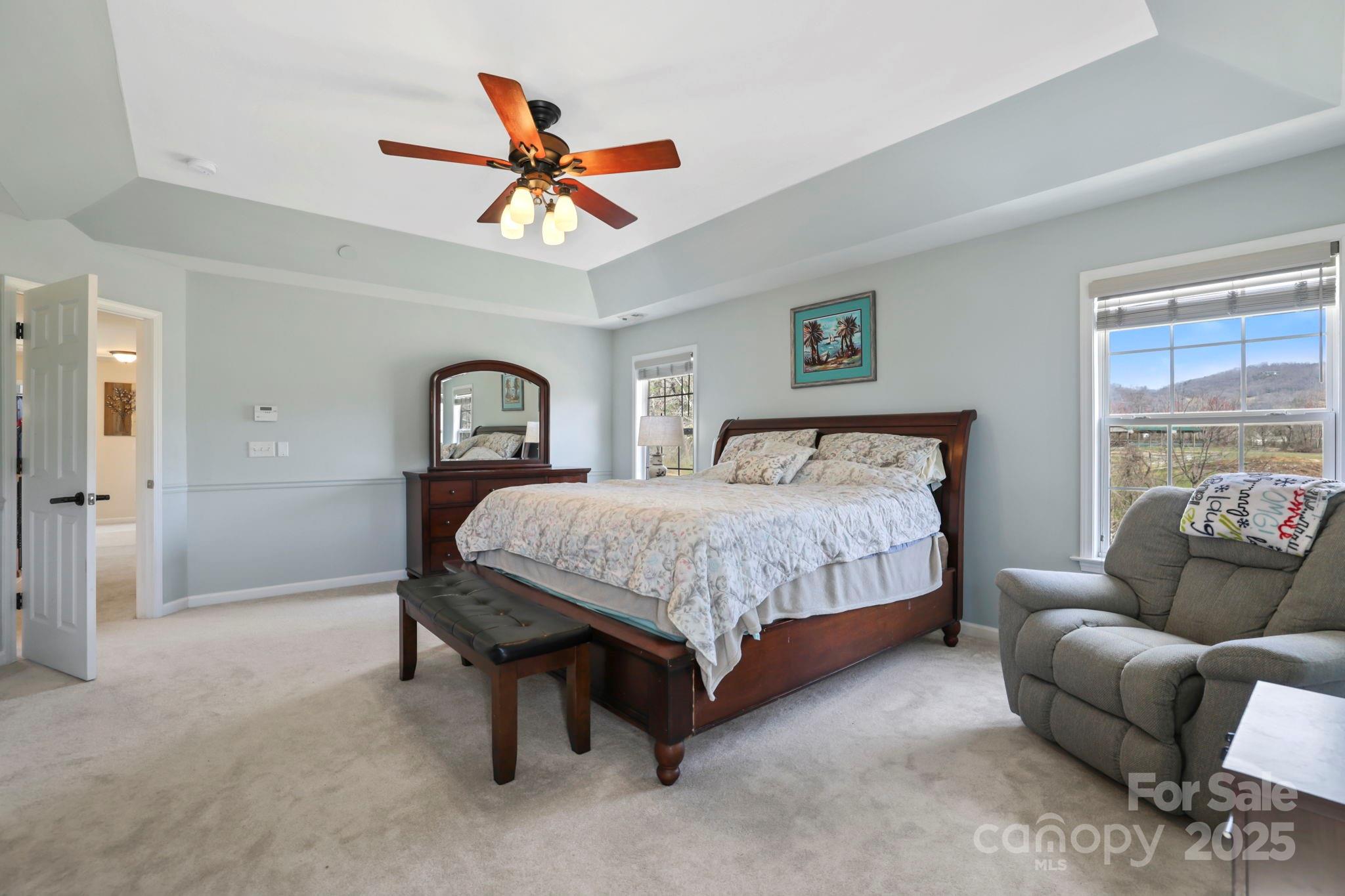 243 Wildbriar Road Fletcher, NC 28732 - Photo 21 of 36 a bedroom with a bed couch and window