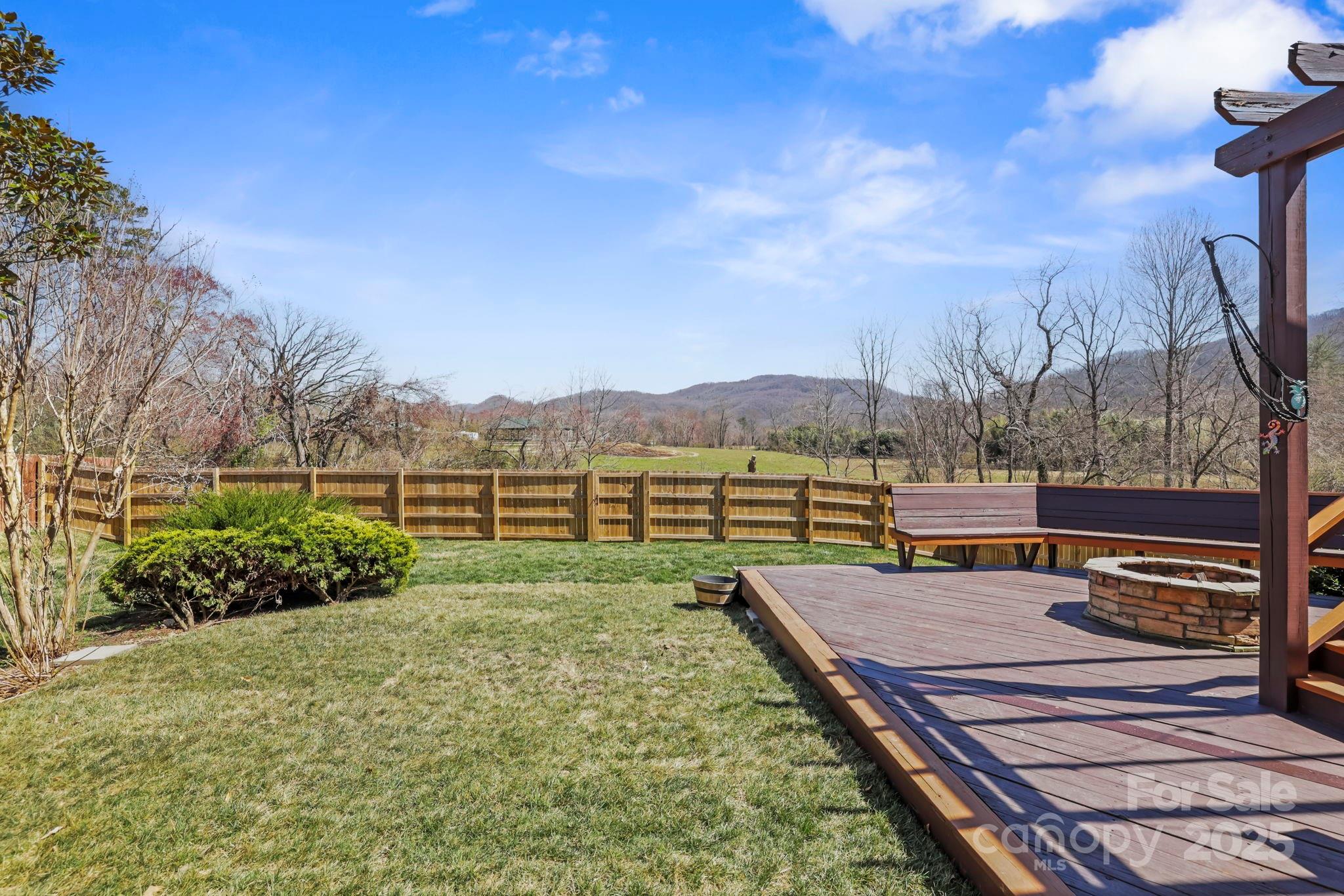 243 Wildbriar Road Fletcher, NC 28732 - Photo 28 of 36 a view of a backyard with sitting area