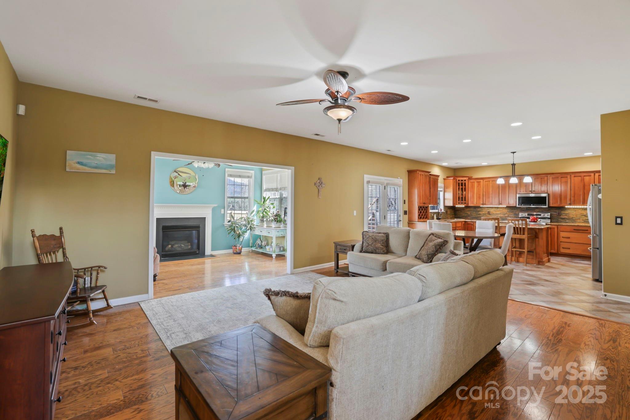243 Wildbriar Road Fletcher, NC 28732 - Photo 7 of 36 a living room with furniture kitchen view and a large window