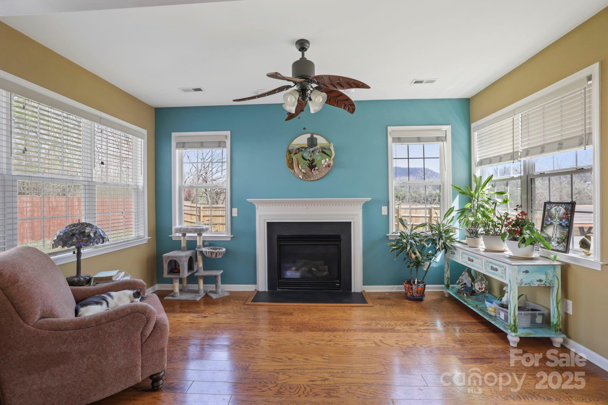 243 Wildbriar Road Fletcher, NC 28732 - Photo 8 of 36 a living room with furniture and a fireplace