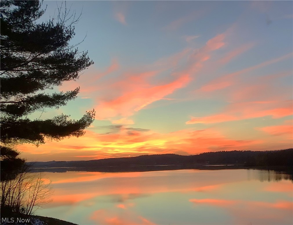 2873 Lodge Road Southwest Sherrodsville, OH 44675 - Photo 10 of 50 One of the fabulous sunsets the owners have enjoyed from this incredible lake home