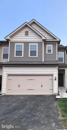 a front view of a house with garage
