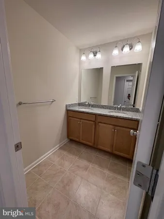 a view of an empty room and a window