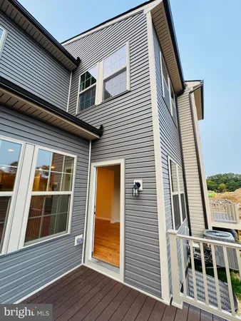 a view of balcony with wooden floor