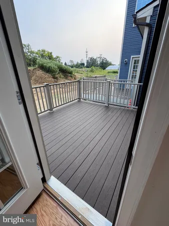 a view of balcony with hardwood floor