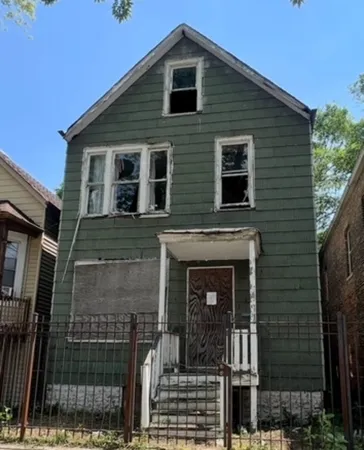 a front view of a house with glass windows