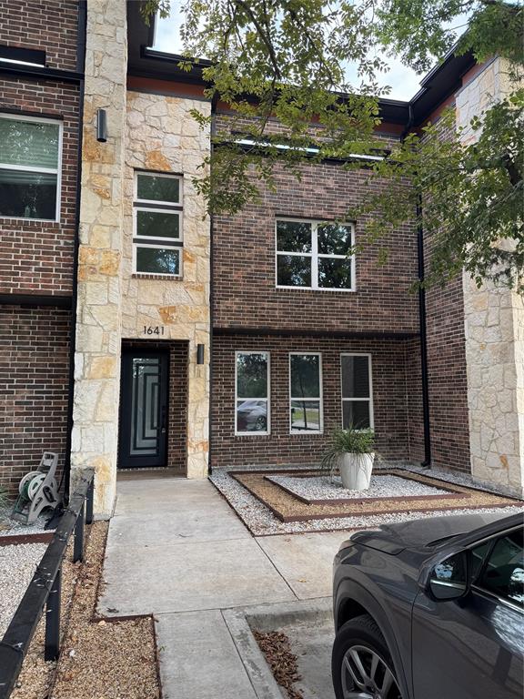 a front view of a house with yard