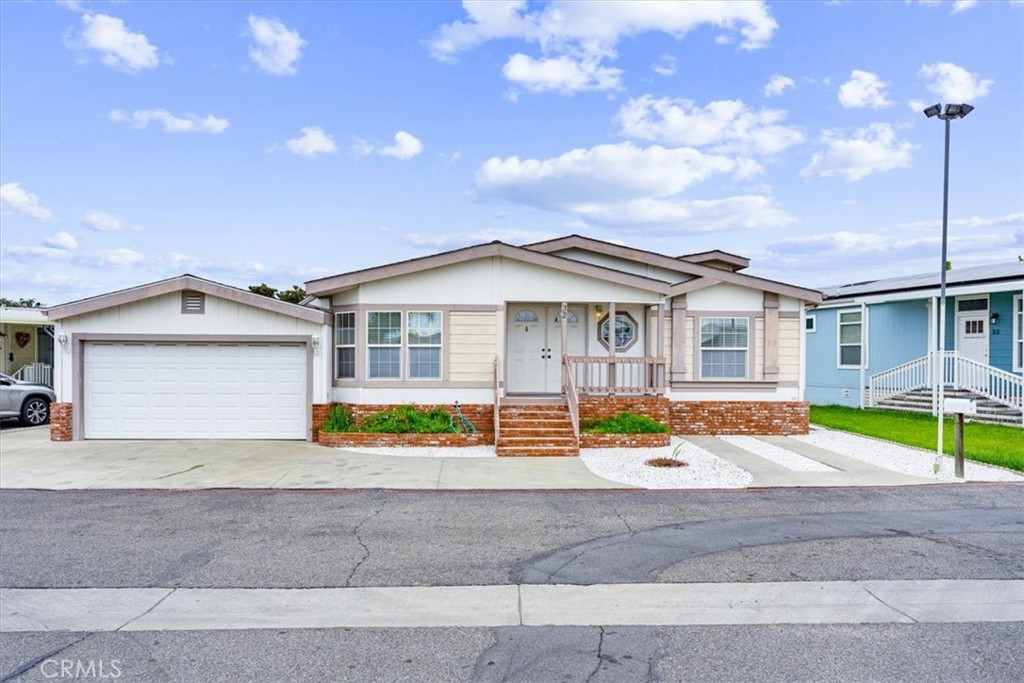 a view of house with outdoor space and shower