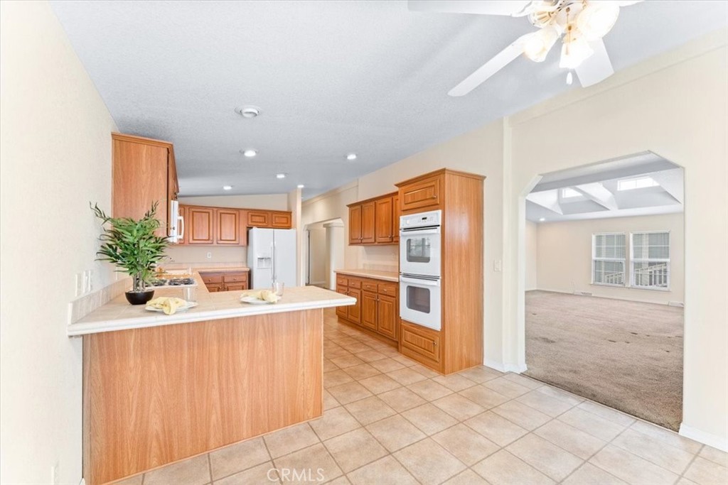 32 Pine Via Anaheim, CA 92801 - Photo 12 of 19 a kitchen with a sink a counter top space and appliances