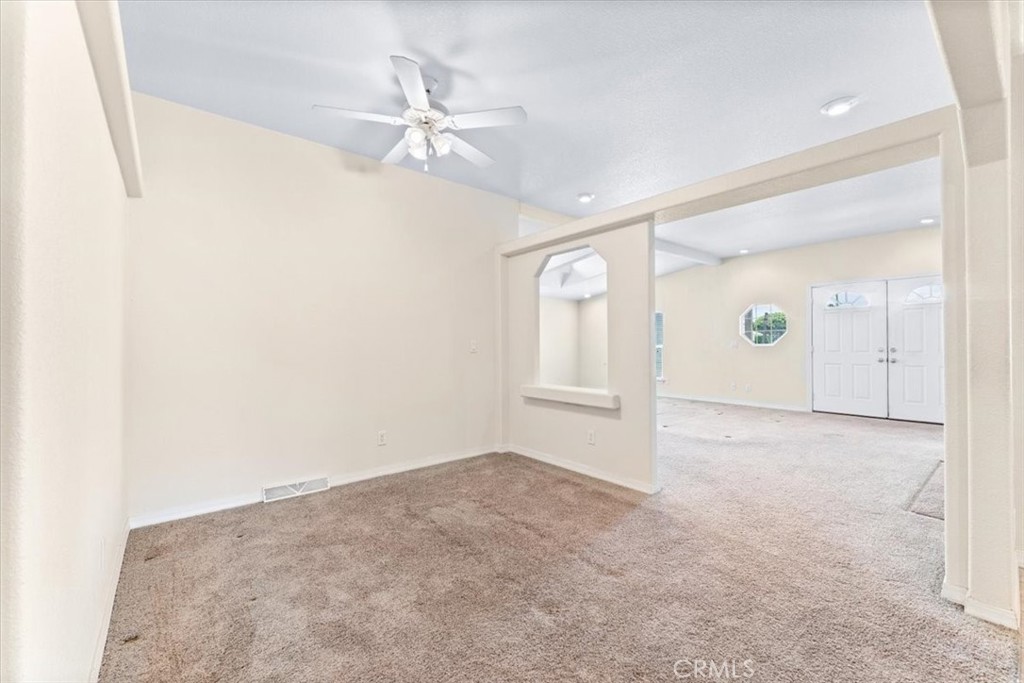 32 Pine Via Anaheim, CA 92801 - Photo 8 of 19 an empty room with fan and windows