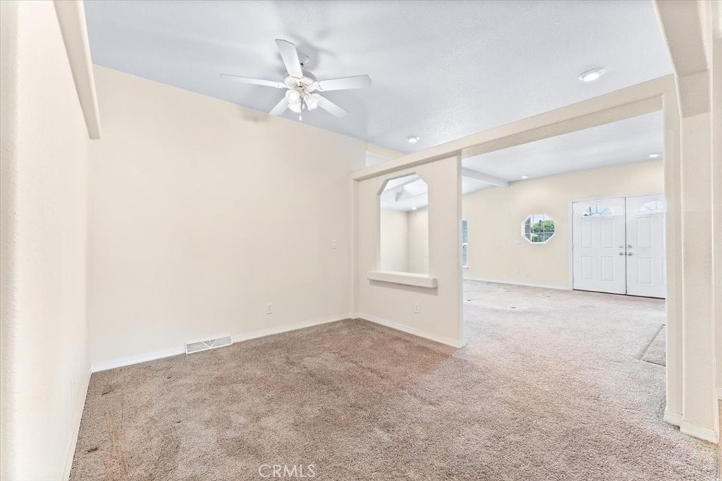 32 Pine Via Anaheim, CA 92801 - Photo 9 of 19 an empty room with fan and windows
