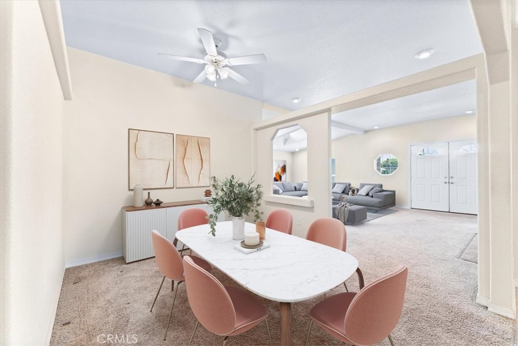 32 Pine Via Anaheim, CA 92801 - Photo 10 of 19 a living room with furniture a chandelier a mirror and a table
