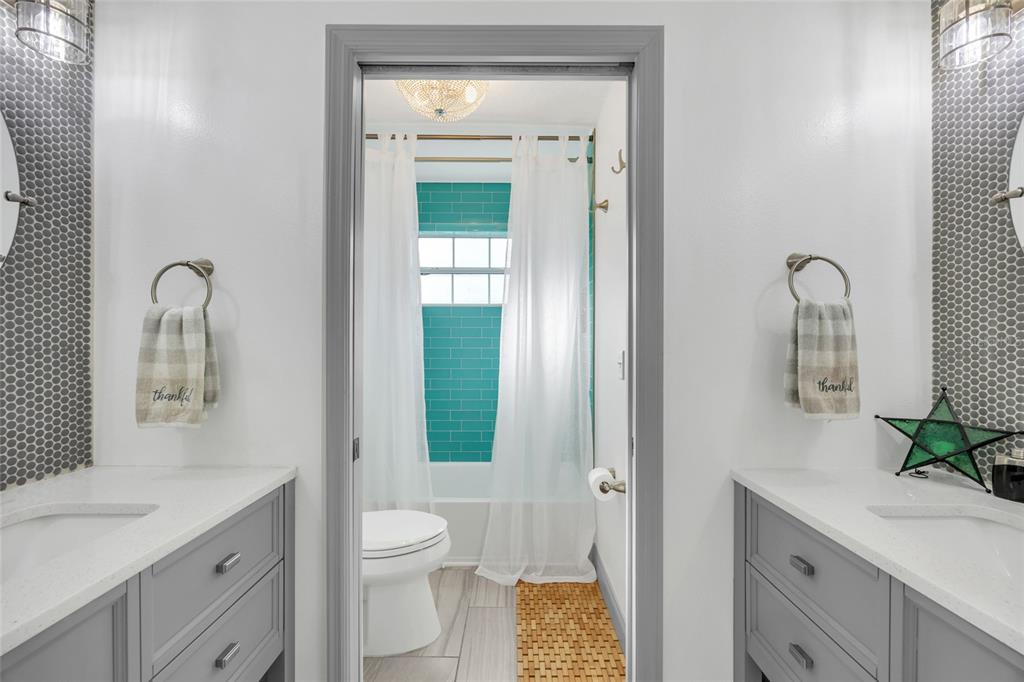 11243 Preston Cove Road Clermont, FL 34711 - Photo 18 of 72 a bathroom with a granite countertop sink a toilet and a mirror