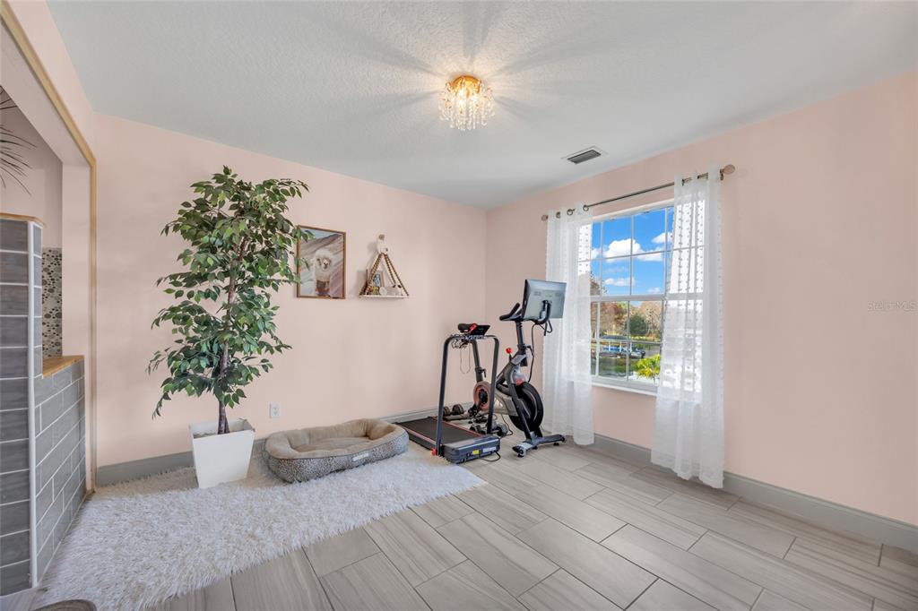 11243 Preston Cove Road Clermont, FL 34711 - Photo 24 of 72 a view of a room with gym equipment