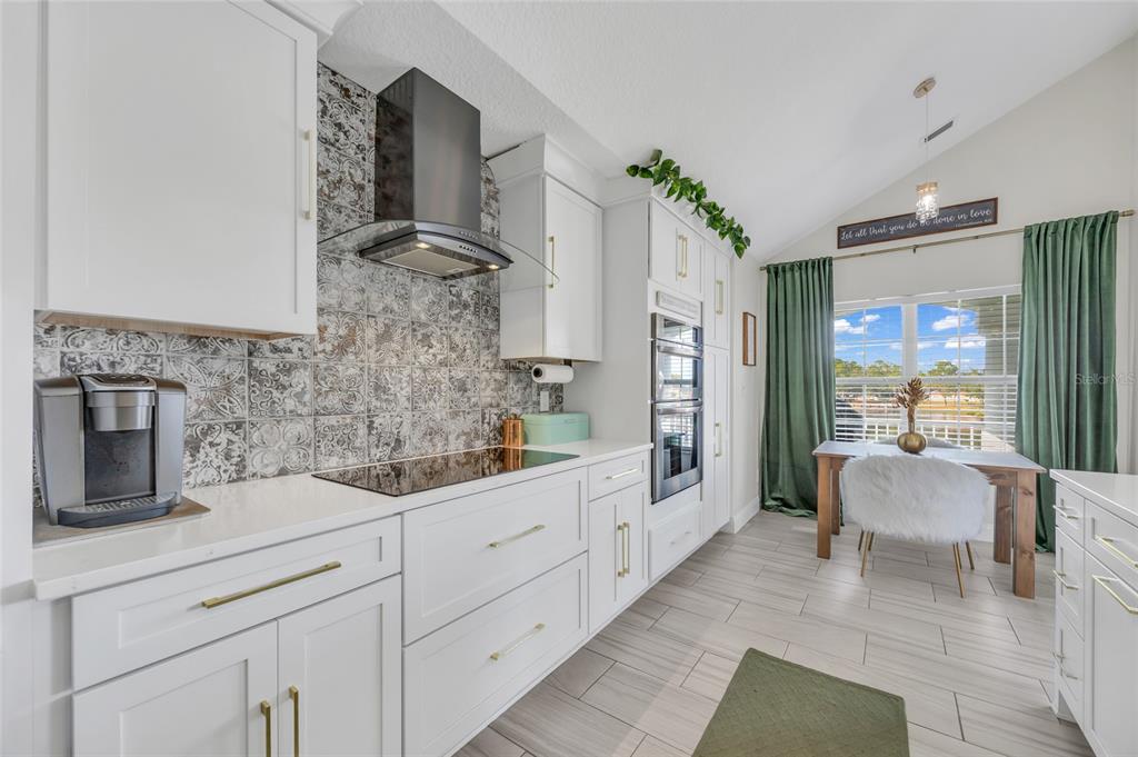 11243 Preston Cove Road Clermont, FL 34711 - Photo 27 of 72 a spacious bathroom with a double vanity sink a toilet a mirror and shower