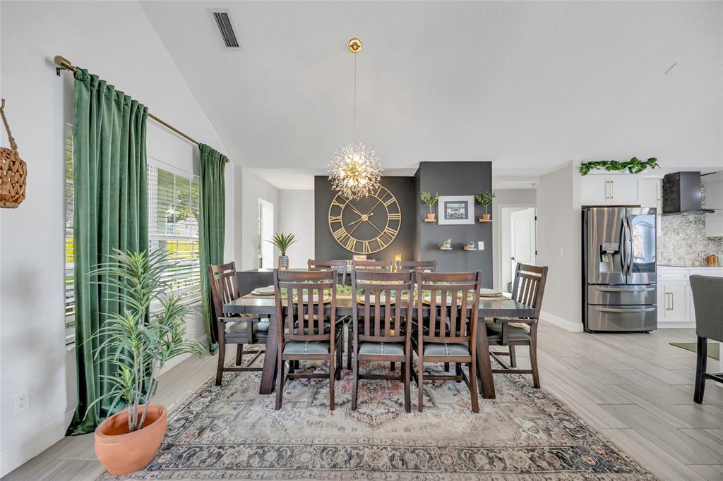 11243 Preston Cove Road Clermont, FL 34711 - Photo 30 of 72 a view of a dining room with furniture and window
