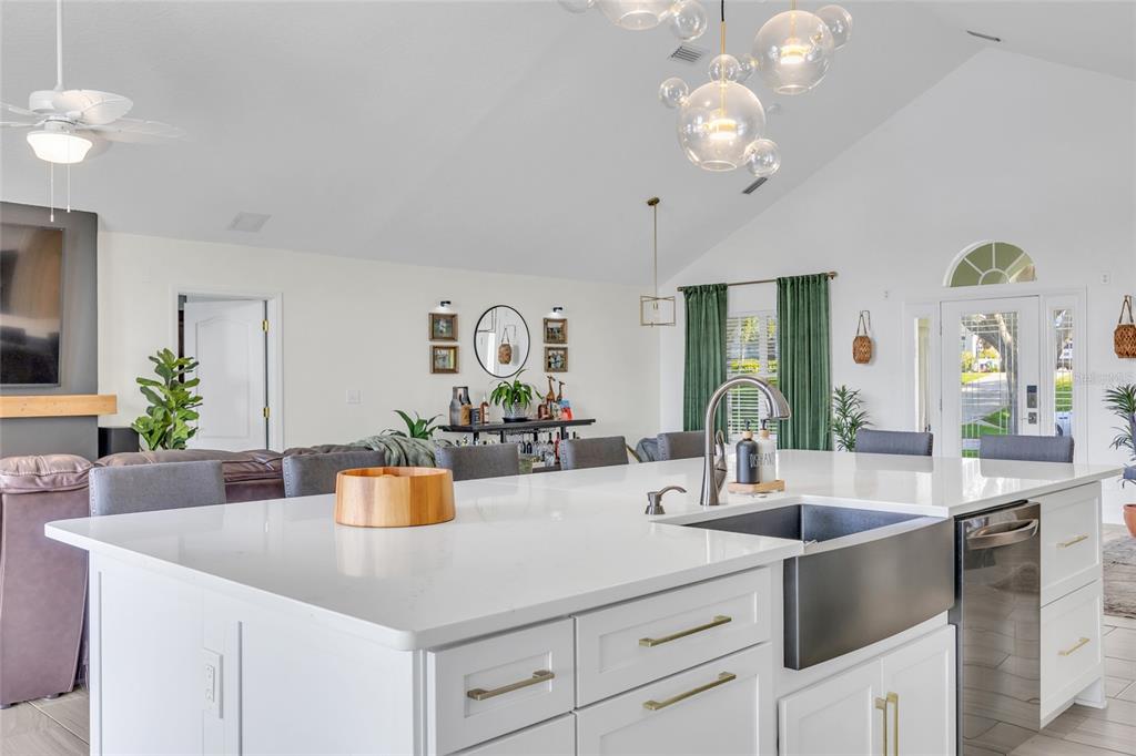 11243 Preston Cove Road Clermont, FL 34711 - Photo 34 of 72 a kitchen with a sink and chandelier