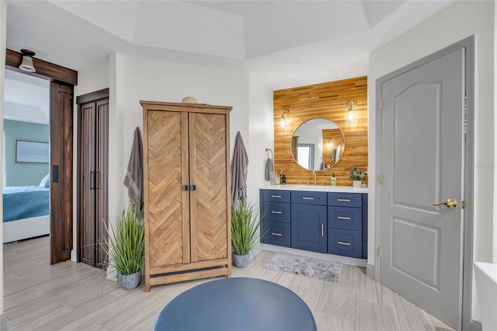 11243 Preston Cove Road Clermont, FL 34711 - Photo 37 of 72 a bedroom with a bed and a dresser