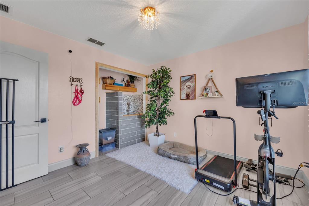 11243 Preston Cove Road Clermont, FL 34711 - Photo 49 of 72 a living room with furniture and a window