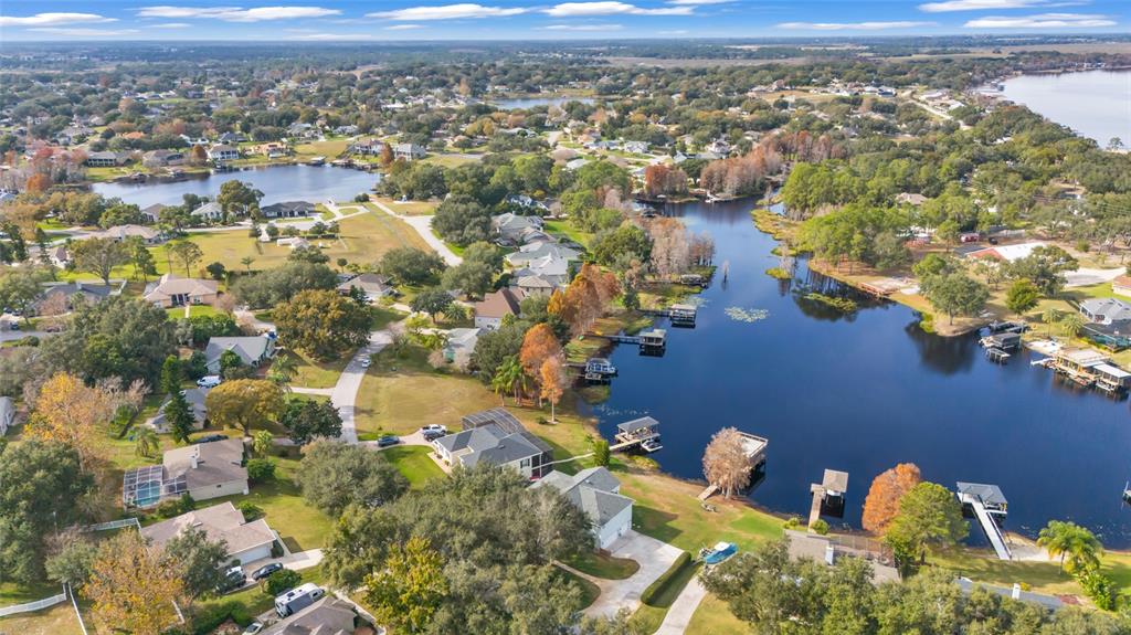 11243 Preston Cove Road Clermont, FL 34711 - Photo 57 of 72 an aerial view of residential houses with outdoor space
