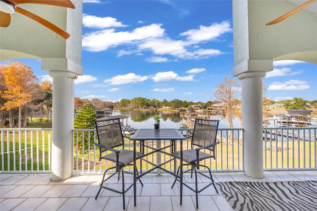 11243 Preston Cove Road Clermont, FL 34711 - Photo 9 of 72 a view of a balcony with furniture