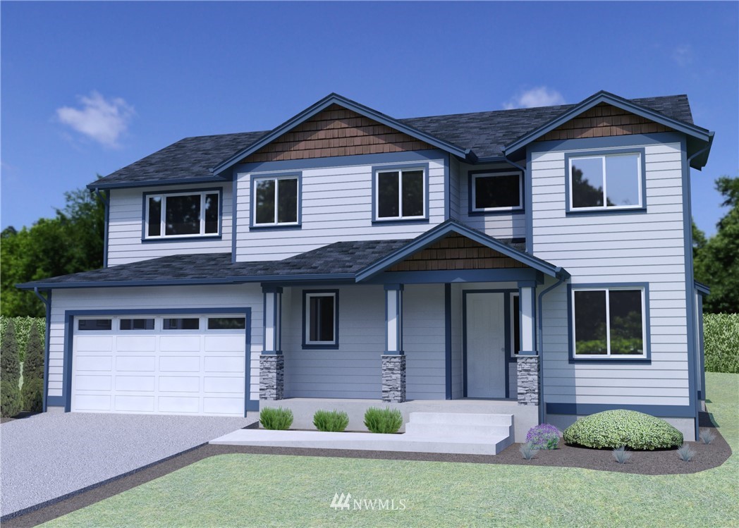 4900 Northeast 1st Street Renton, WA 98059 - Photo 1 of 14 a front view of a house with a yard and garage