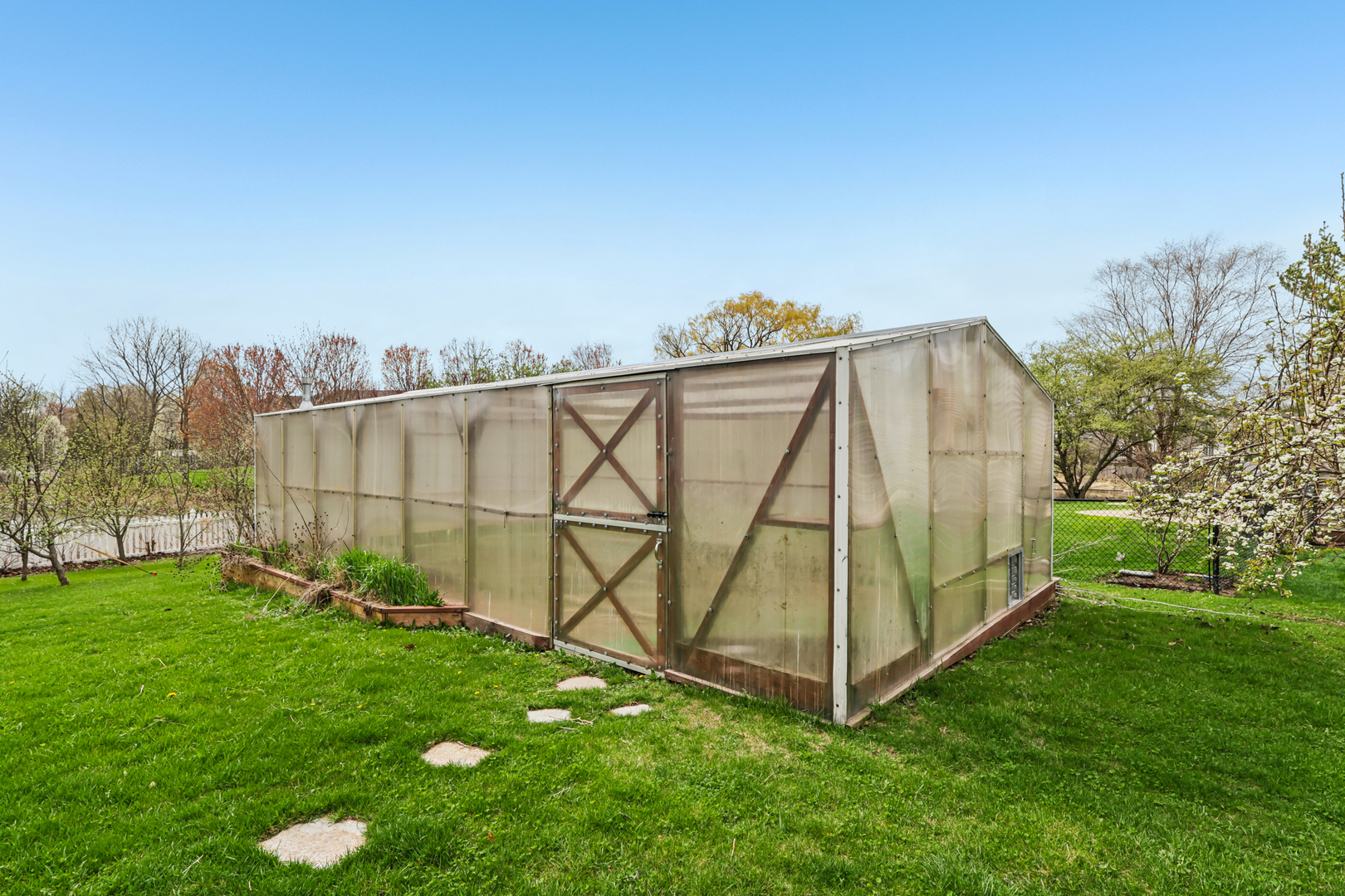 257 Indian Ridge Lane Lake Villa, IL 60046 - Photo 17 of 38 a view of a backyard with white house