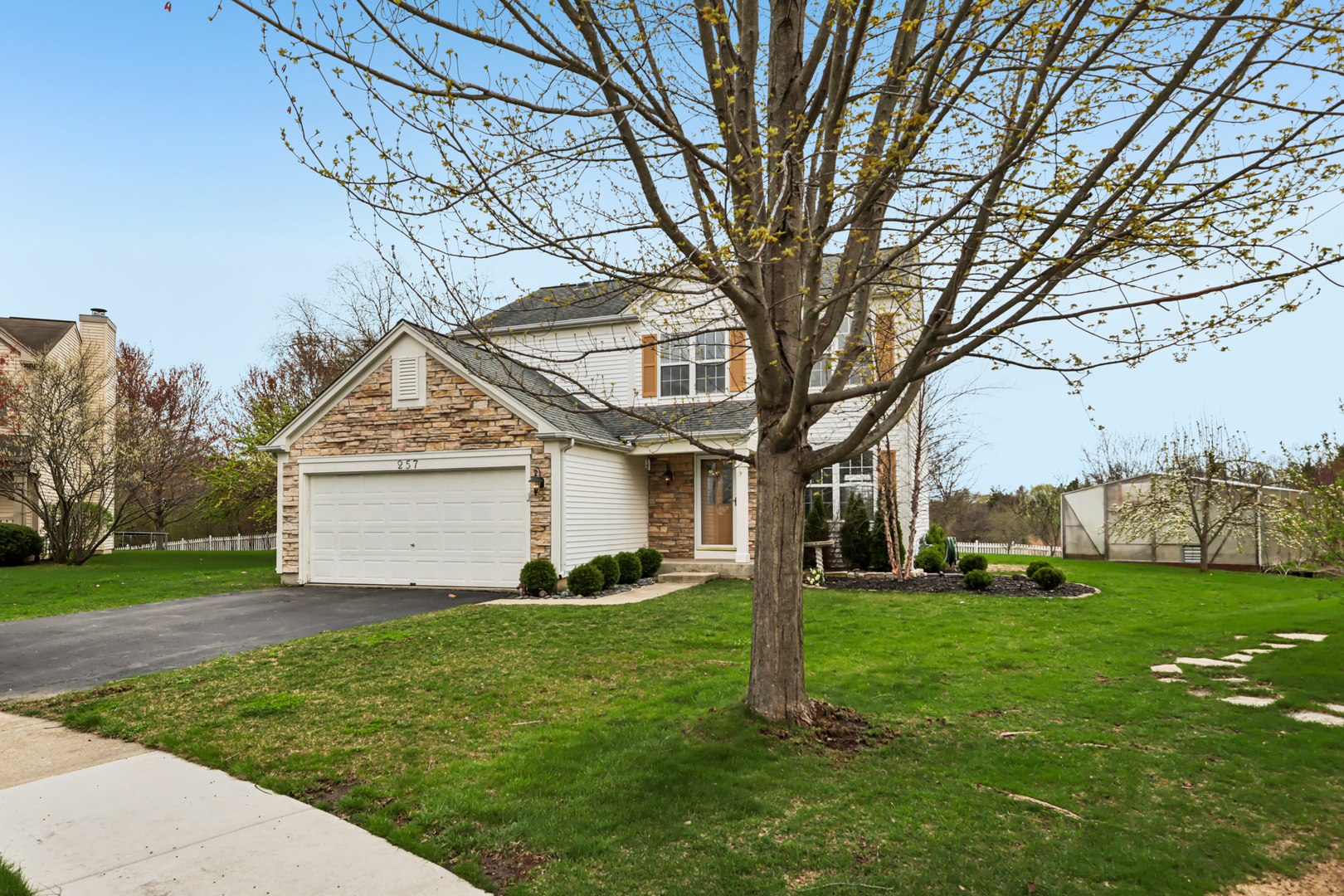 257 Indian Ridge Lane Lake Villa, IL 60046 - Photo 20 of 38 a front view of a house with a yard
