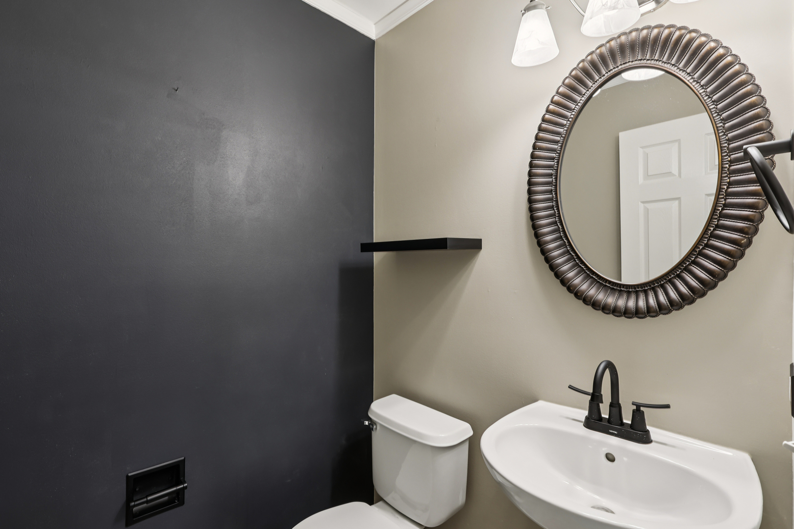 257 Indian Ridge Lane Lake Villa, IL 60046 - Photo 25 of 38 a bathroom with a sink and a mirror