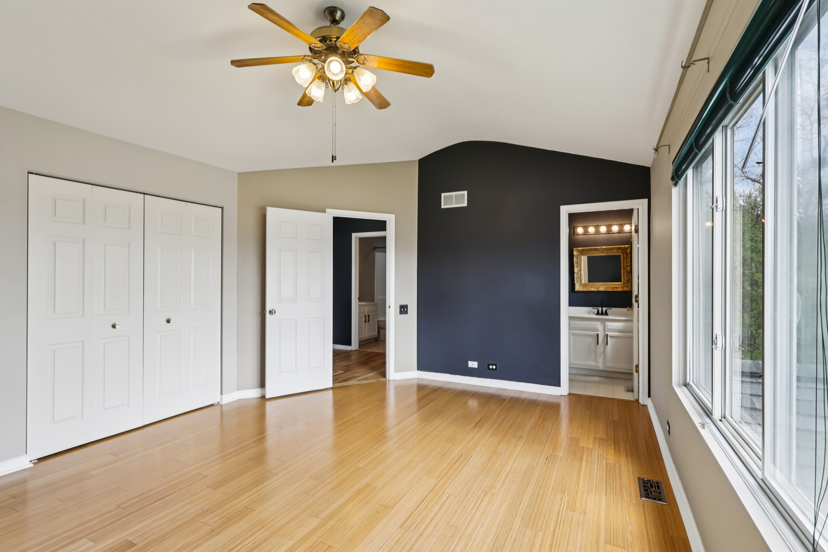 257 Indian Ridge Lane Lake Villa, IL 60046 - Photo 26 of 38 a view of an empty room with window and wooden floor
