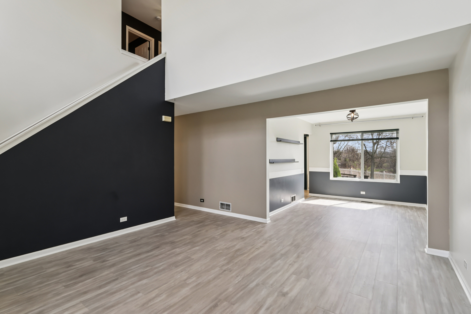 257 Indian Ridge Lane Lake Villa, IL 60046 - Photo 35 of 38 wooden floor in an empty room with a window