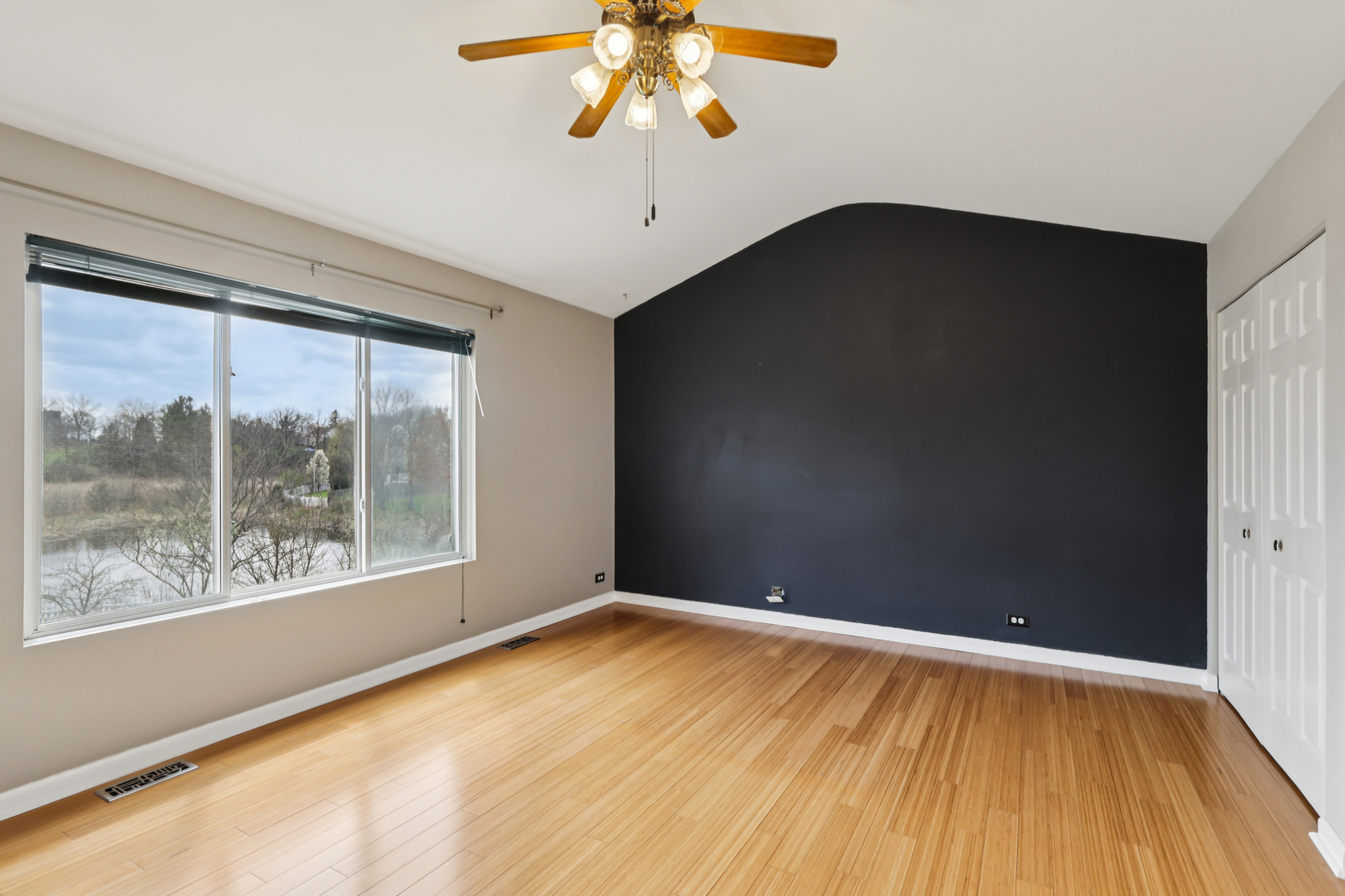 257 Indian Ridge Lane Lake Villa, IL 60046 - Photo 4 of 38 a view of empty room with wooden floor and fan