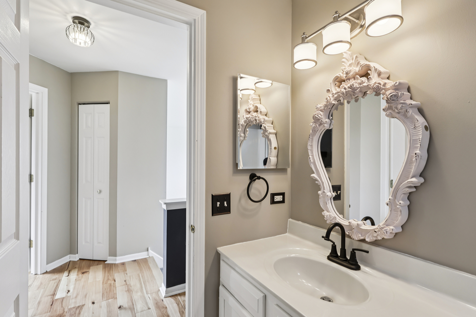 257 Indian Ridge Lane Lake Villa, IL 60046 - Photo 6 of 38 a bathroom with a sink double vanity and a mirror